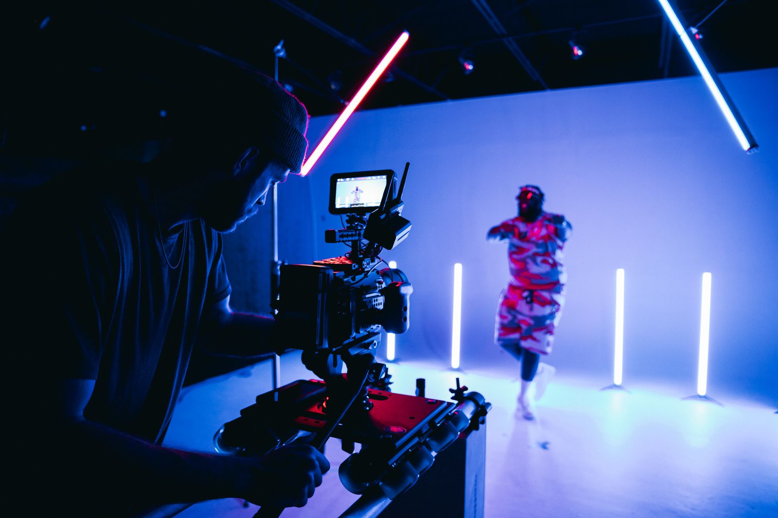 Film crew shooting on a lit studio set